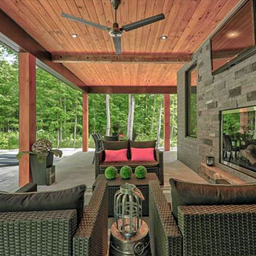 Covered patio with fireplace and outdoor tv