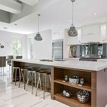 Bright white kitchen with large island and eat-in space